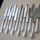 Box of 12 table knives in stainless steel and silver metal