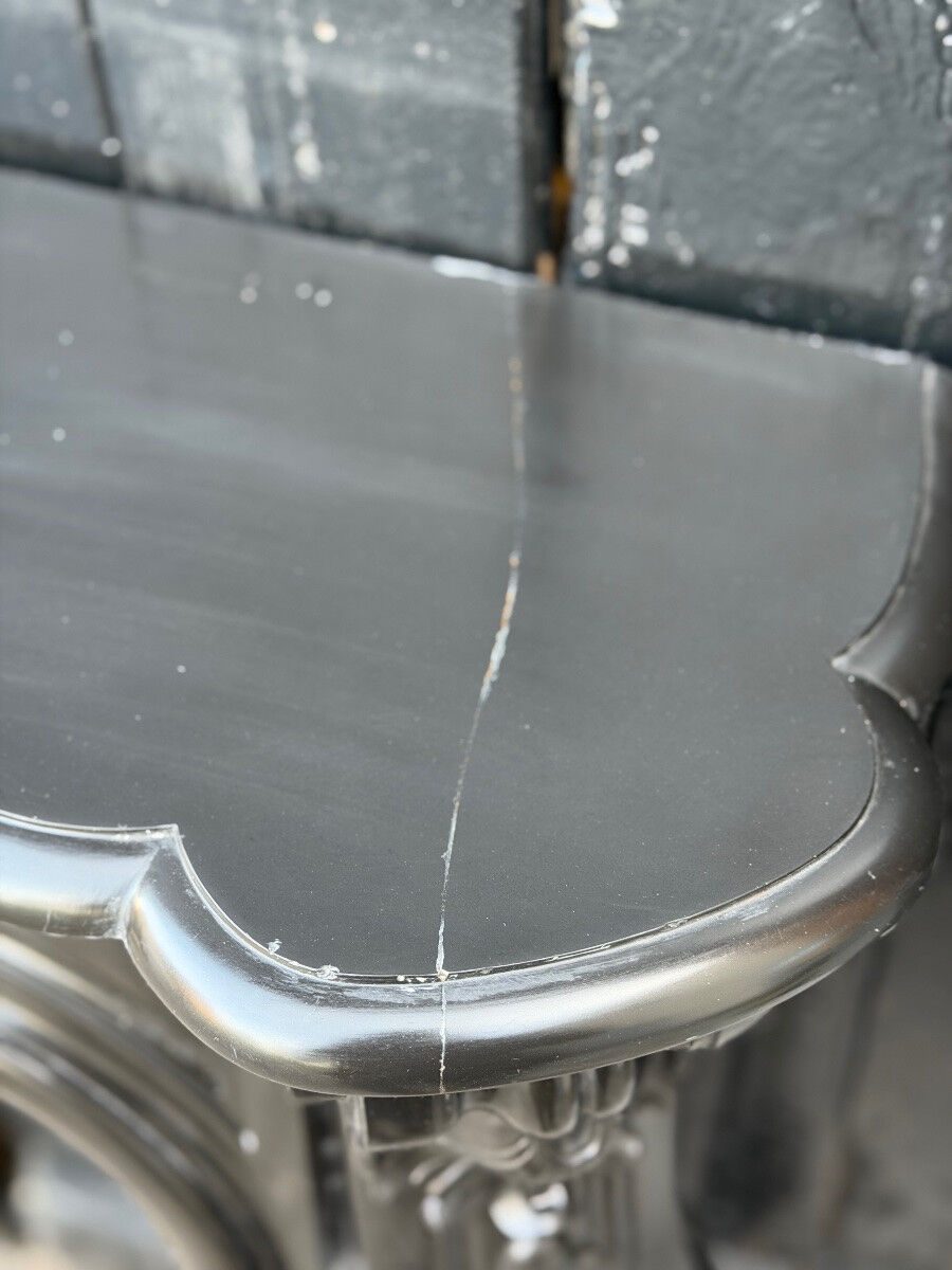 Louis XV style fireplace in black Belgian marble, circa 1880.