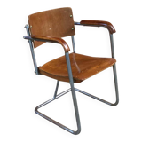 Modernist armchair in plywood, screwed steel tubes