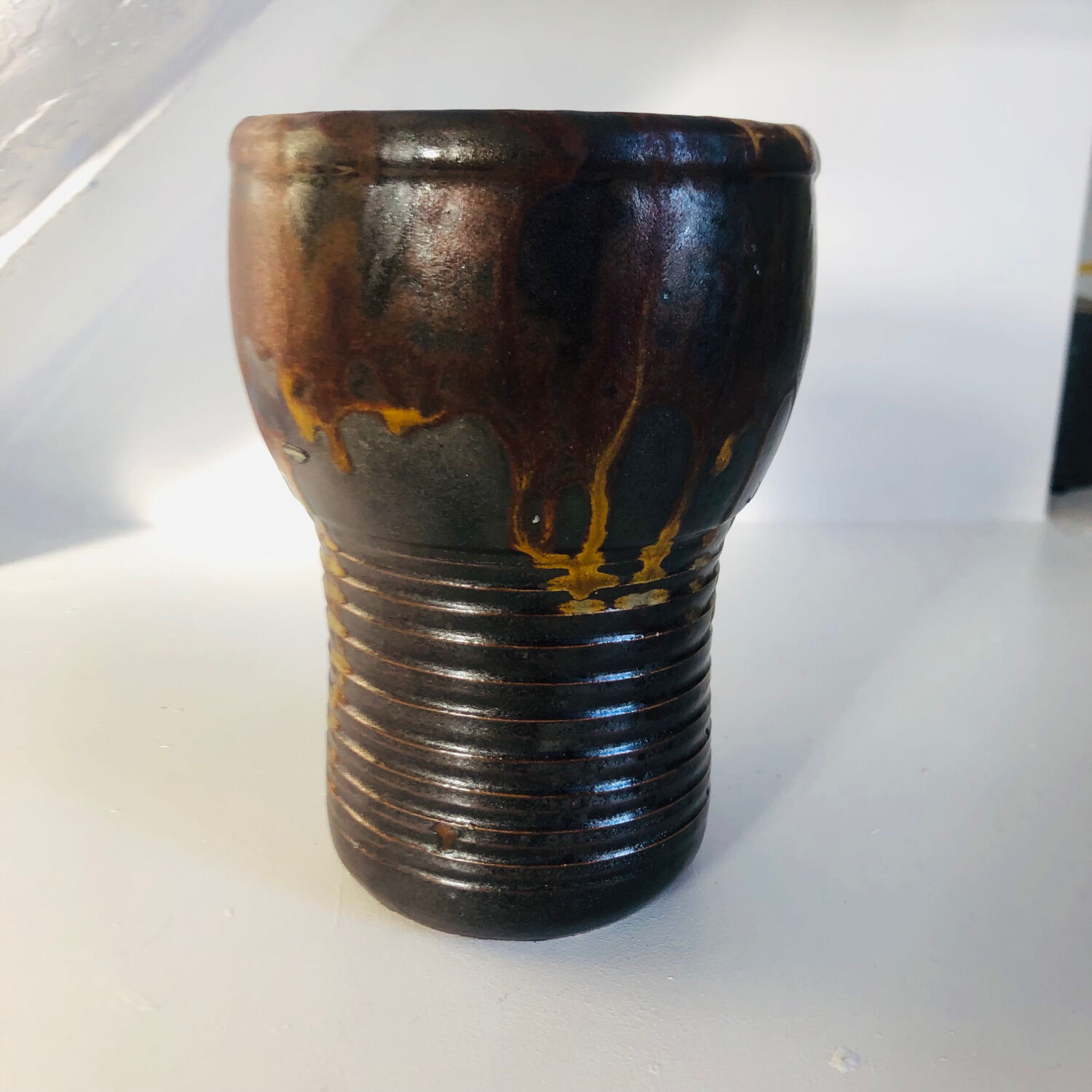 Metallic brown ceramic torso vase