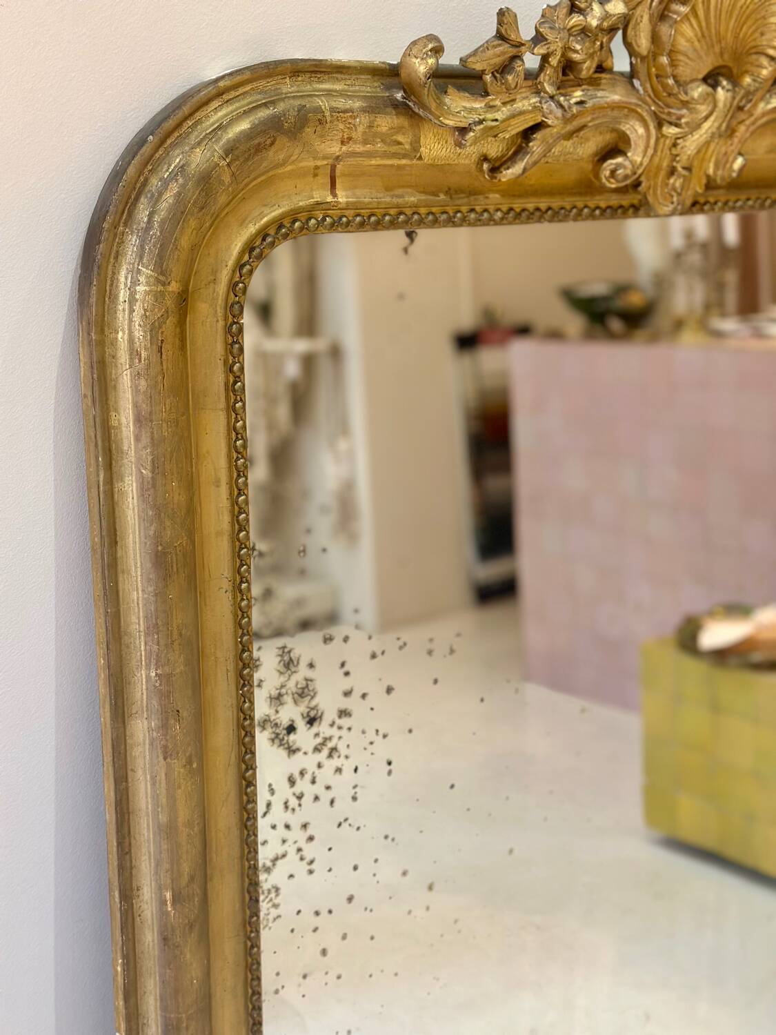 Antique Louis-Philippe mirror carved and gilded with leaf