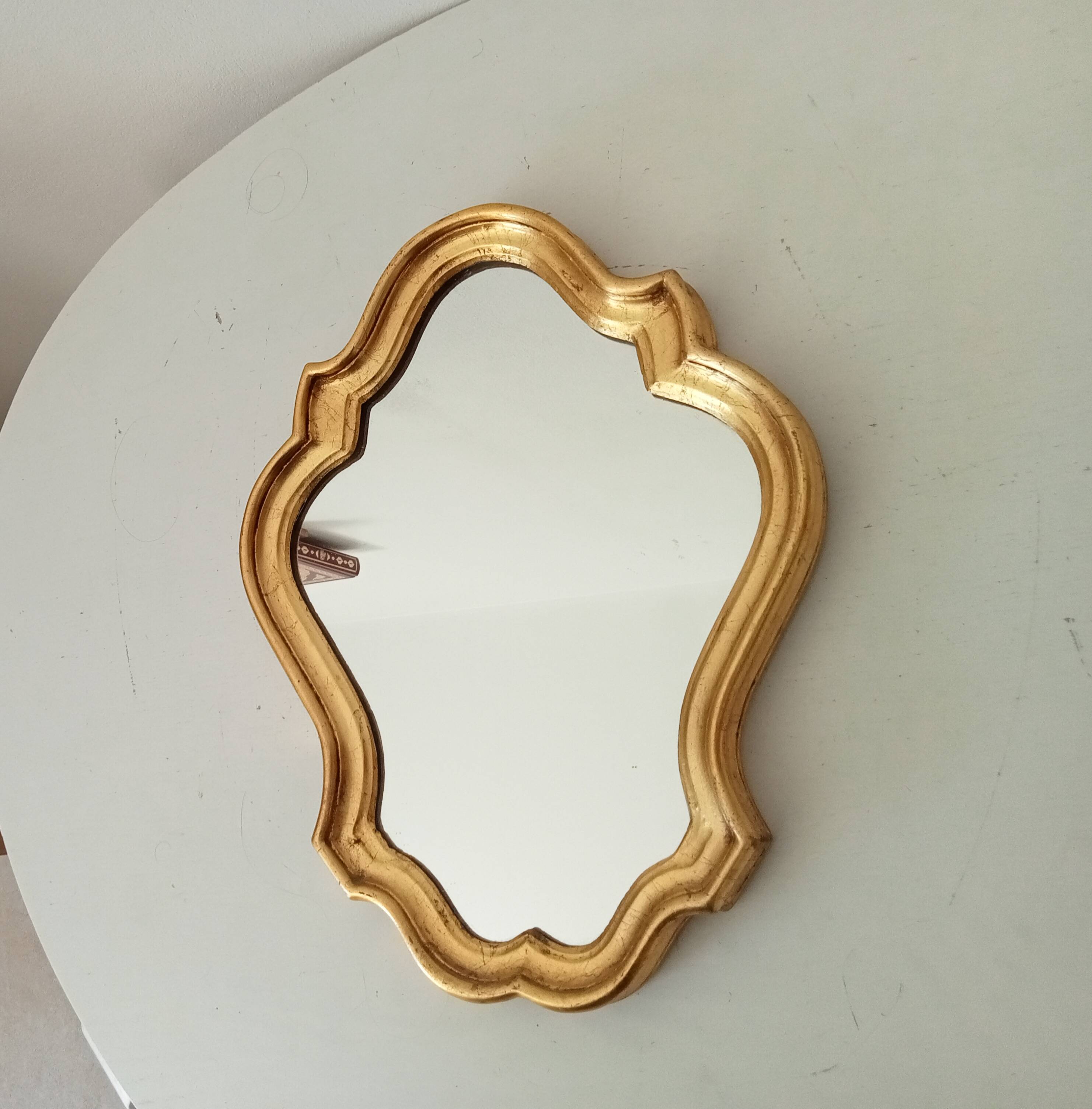 Baroque mirror in gilded wood from the 1960s.