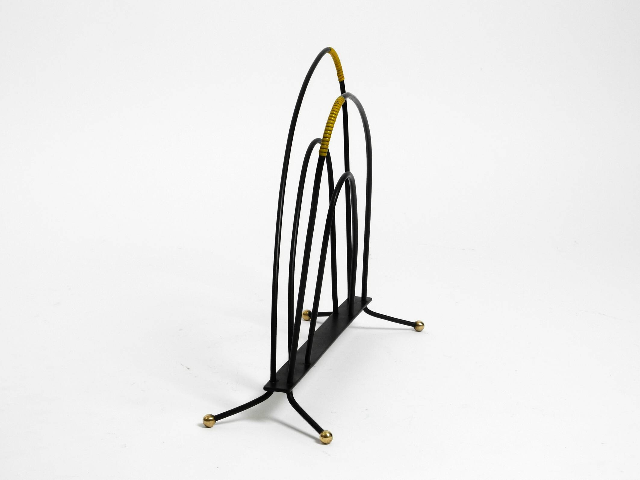 Mid Century newspaper and magazine stand made of iron with brass details