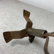 Rose shaped metal candle holder
