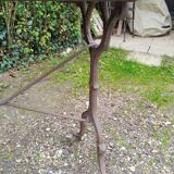 Antique bistro table with iron legs and wooden top