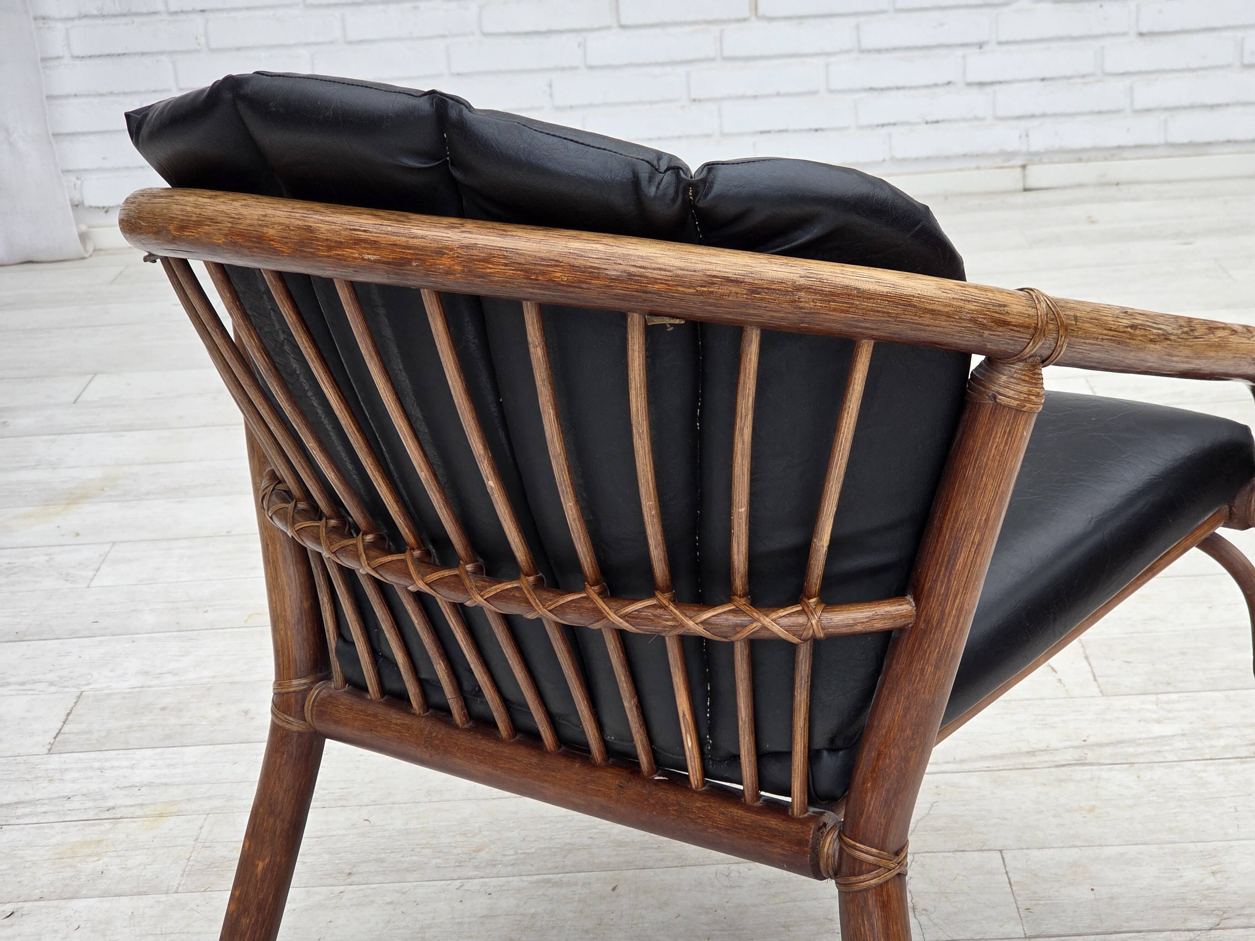 1970s, Danish armchair, rattan, black artificial leather.