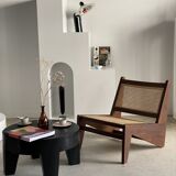 Reclined armchair in canned teak in natural wood