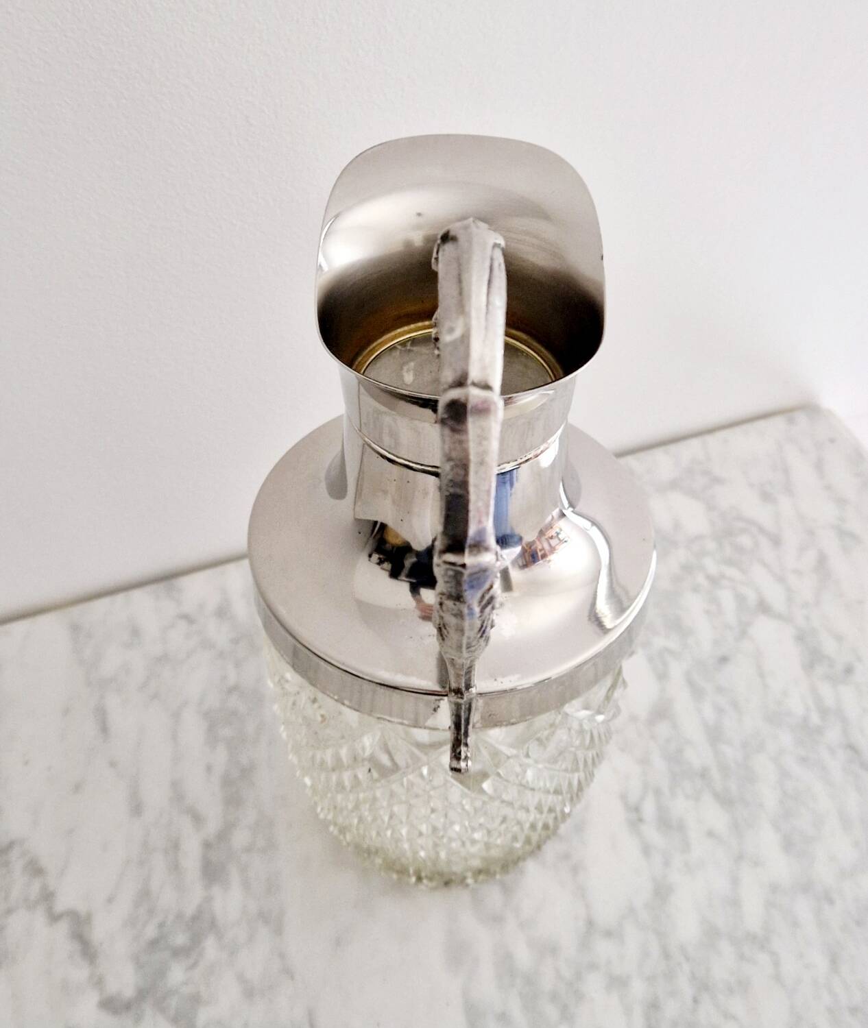 Glass and silver-plated carafe