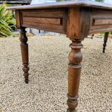 Old French farmhouse table in walnut with turned legs.