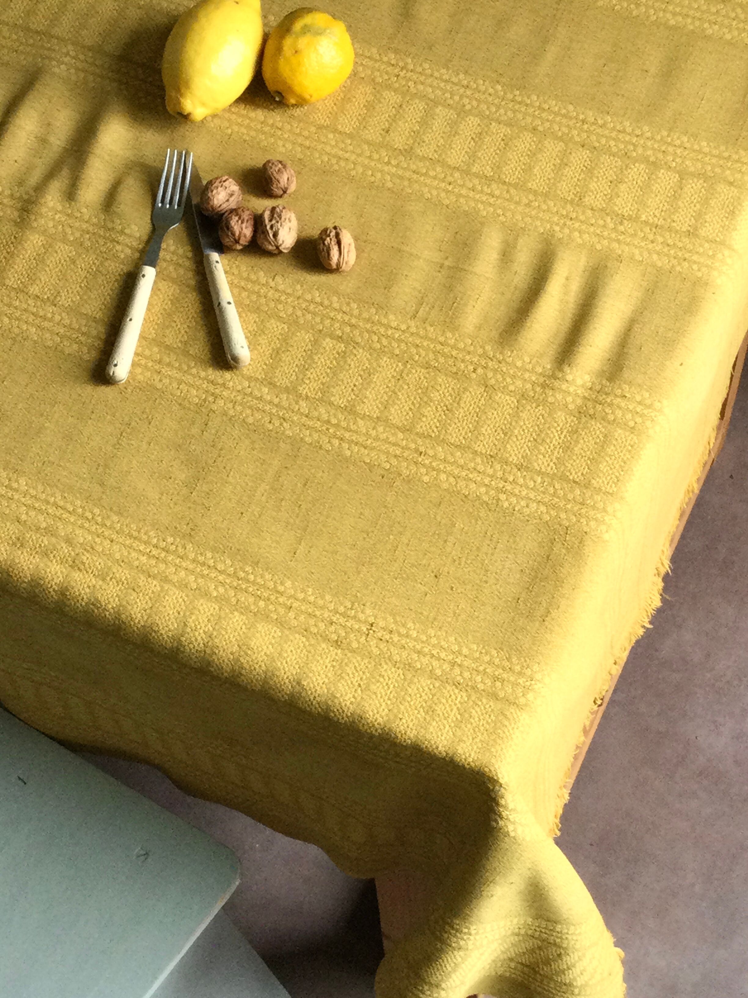 Old damask tablecloth tinted curry yellow