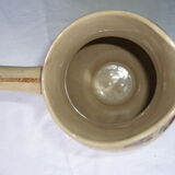 Antique pitcher decorated with flowers