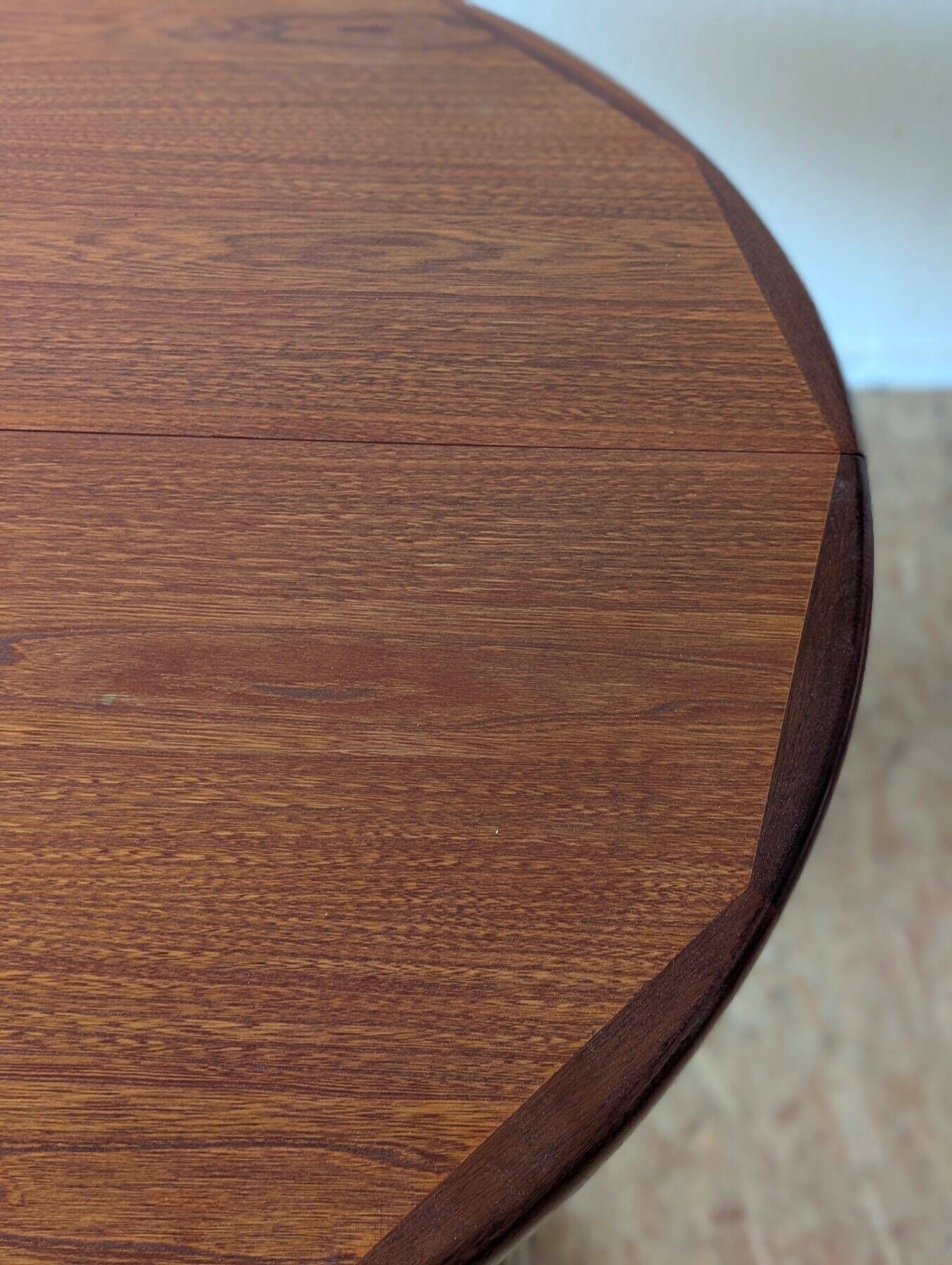 Round teak table with star base, 1960s, extendable.