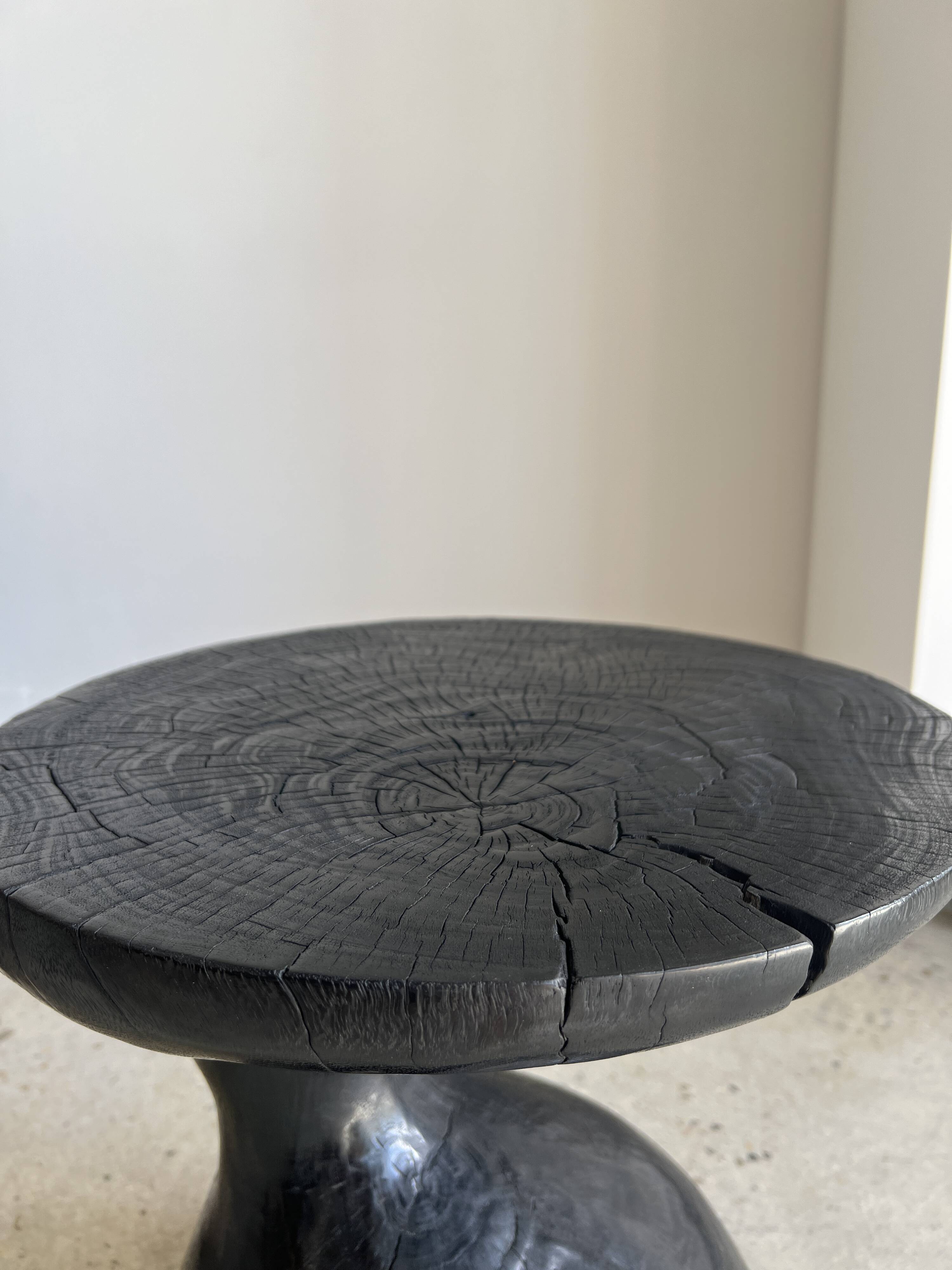 Solid wood (monoxyl) side table, organic shape, black color