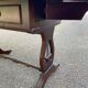 Victorian English extendable coffee table made of solid mahogany and leather.