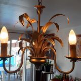 Vintage chandelier in golden metal