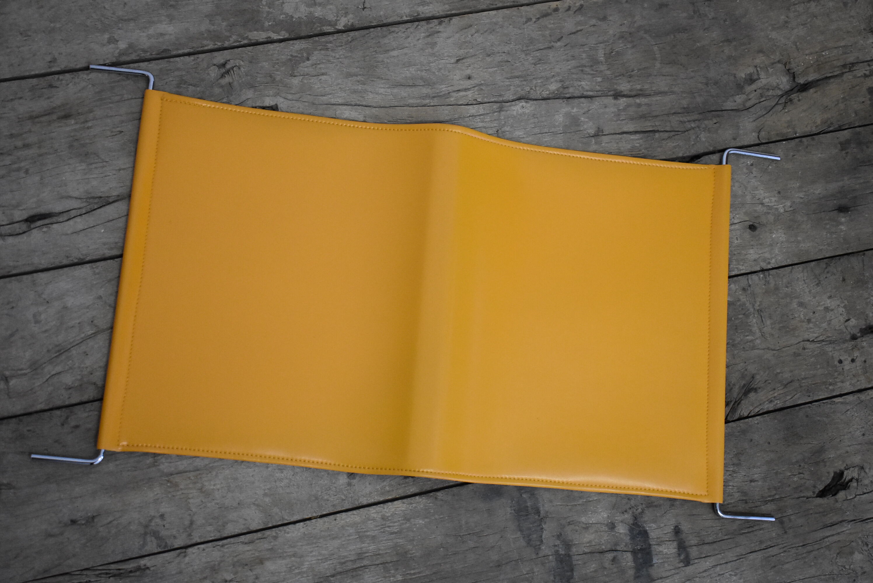 70s Orange magazine holder by Max Sauzé