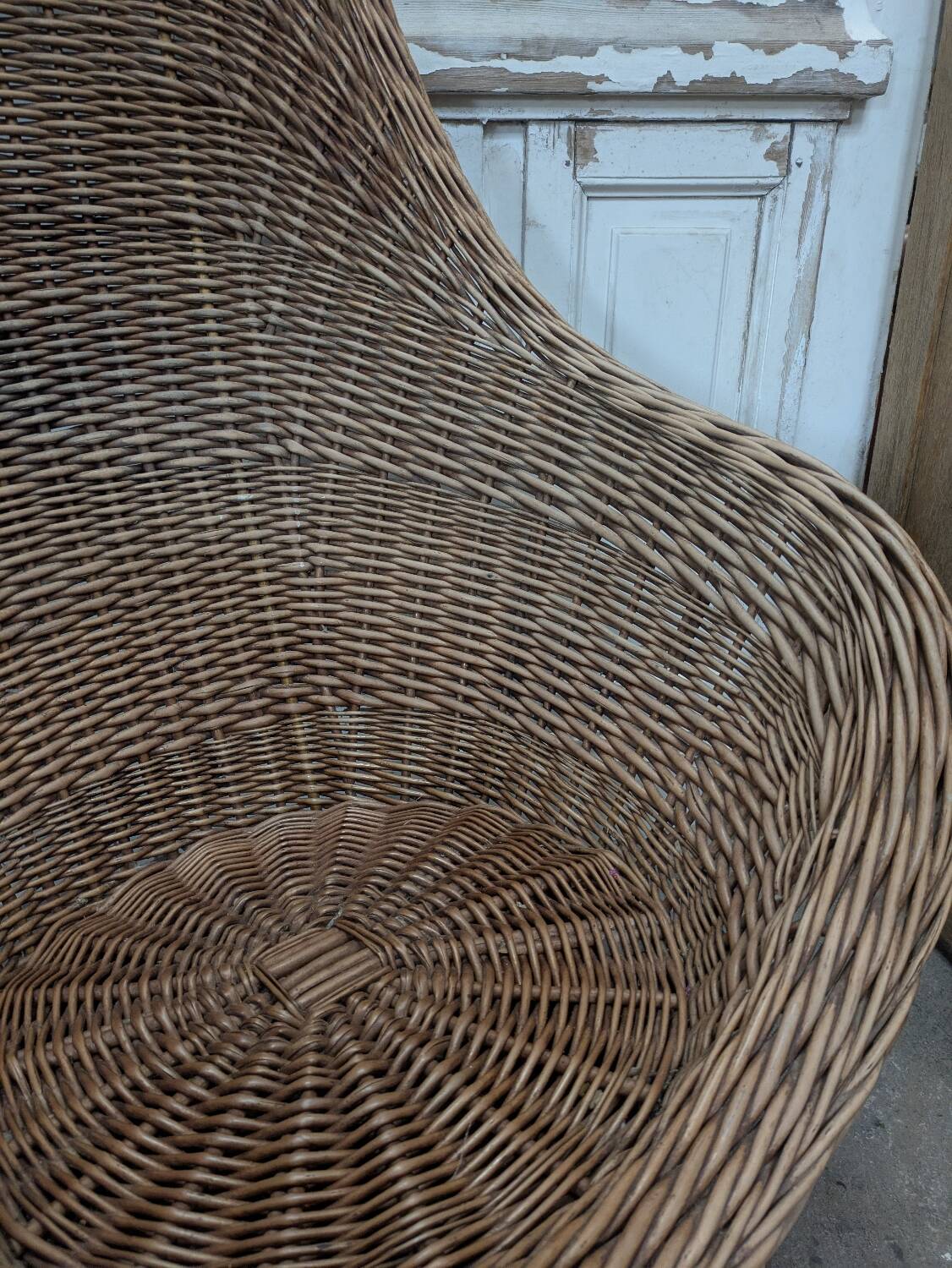 Large woven rattan armchair