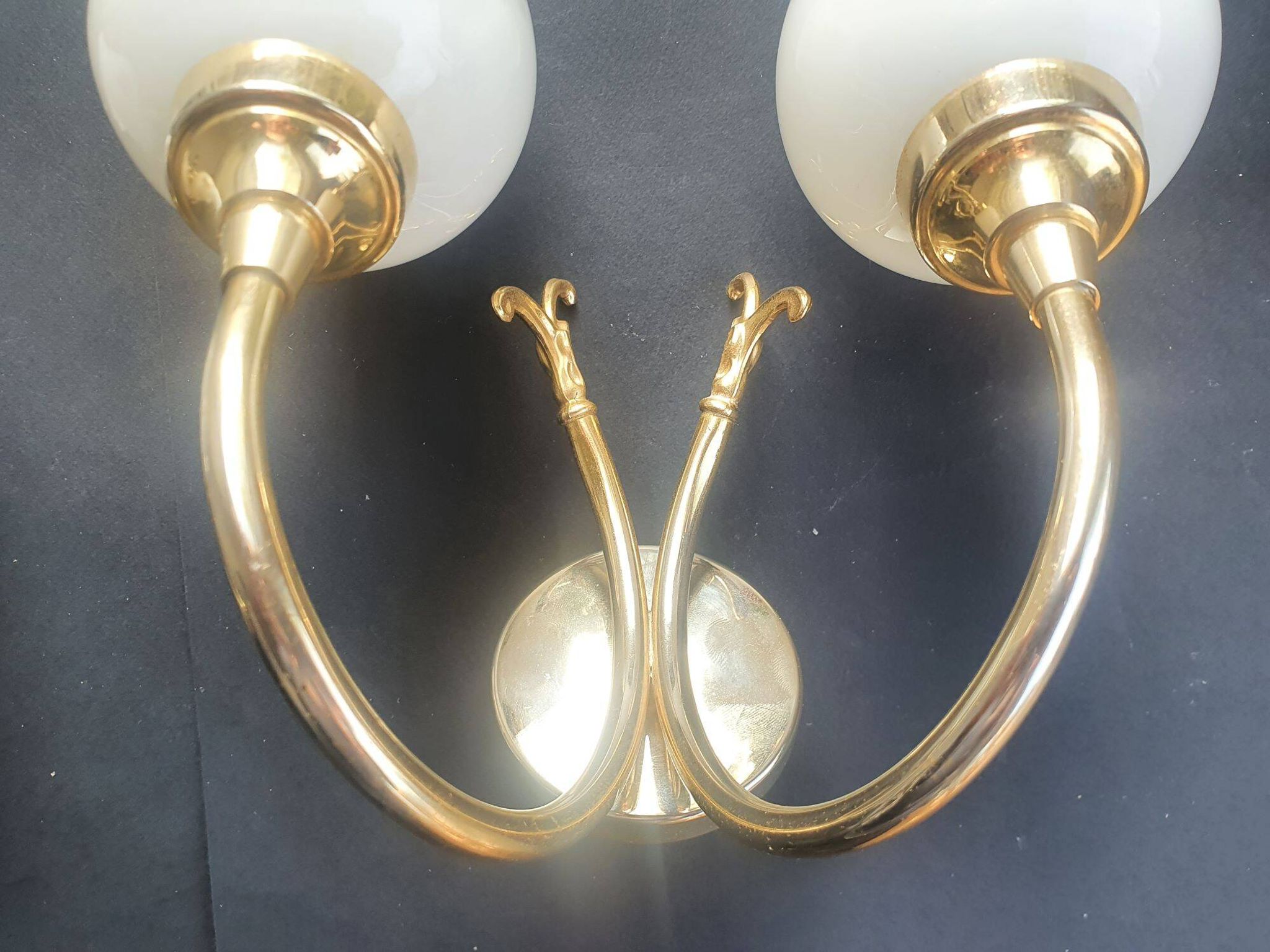 Pair of vintage wall sconces in gilded brass and pink opaline glass.