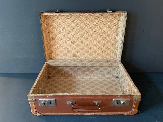 Old travel suitcase and legendary stickers, 1920