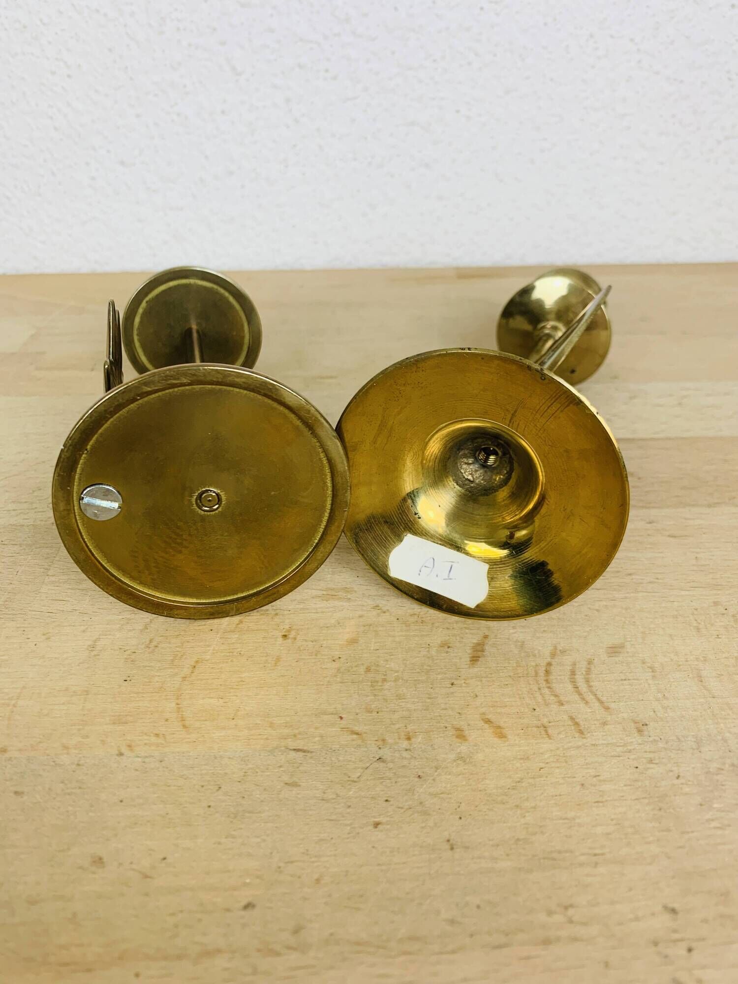 Pair of mother-of-pearl brass candlesticks with moon and sun