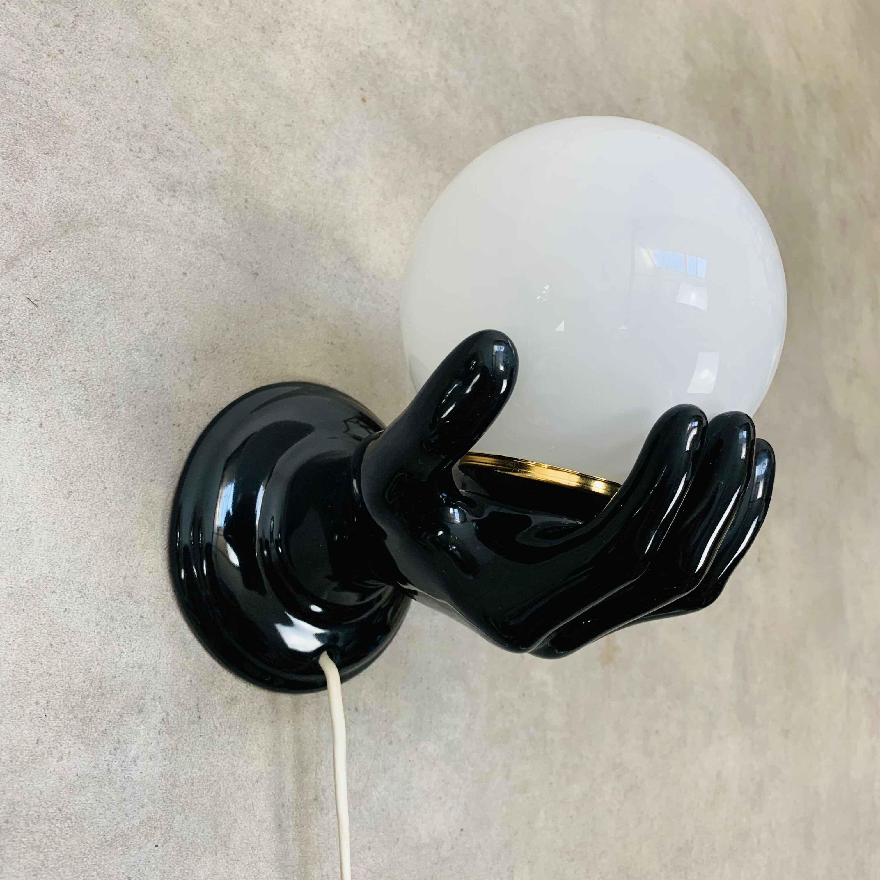 Black and opaline ceramic hand lamp