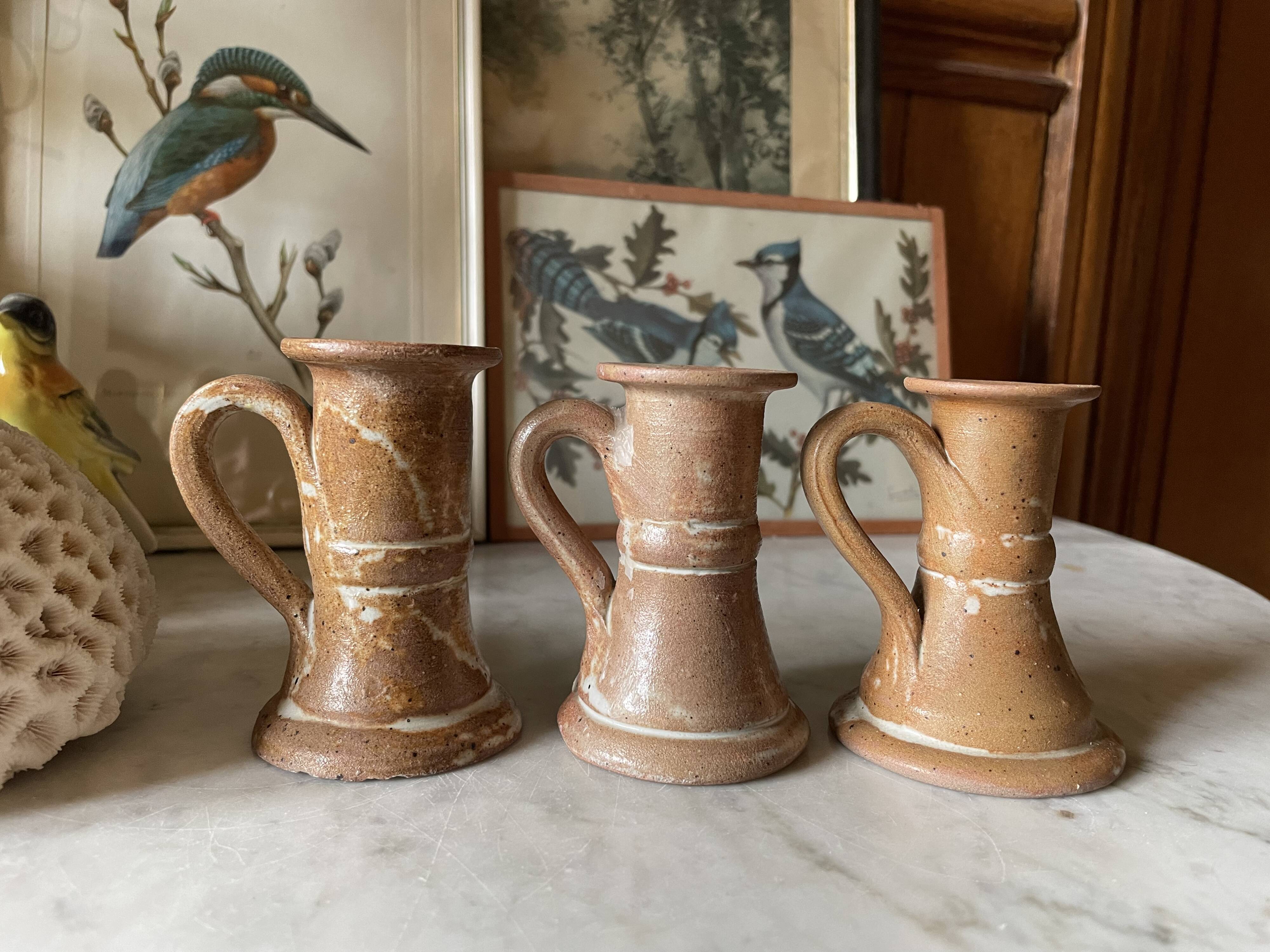 Trio of stoneware candle holders