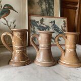 Trio of stoneware candle holders