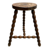 Wooden tripod farm stool