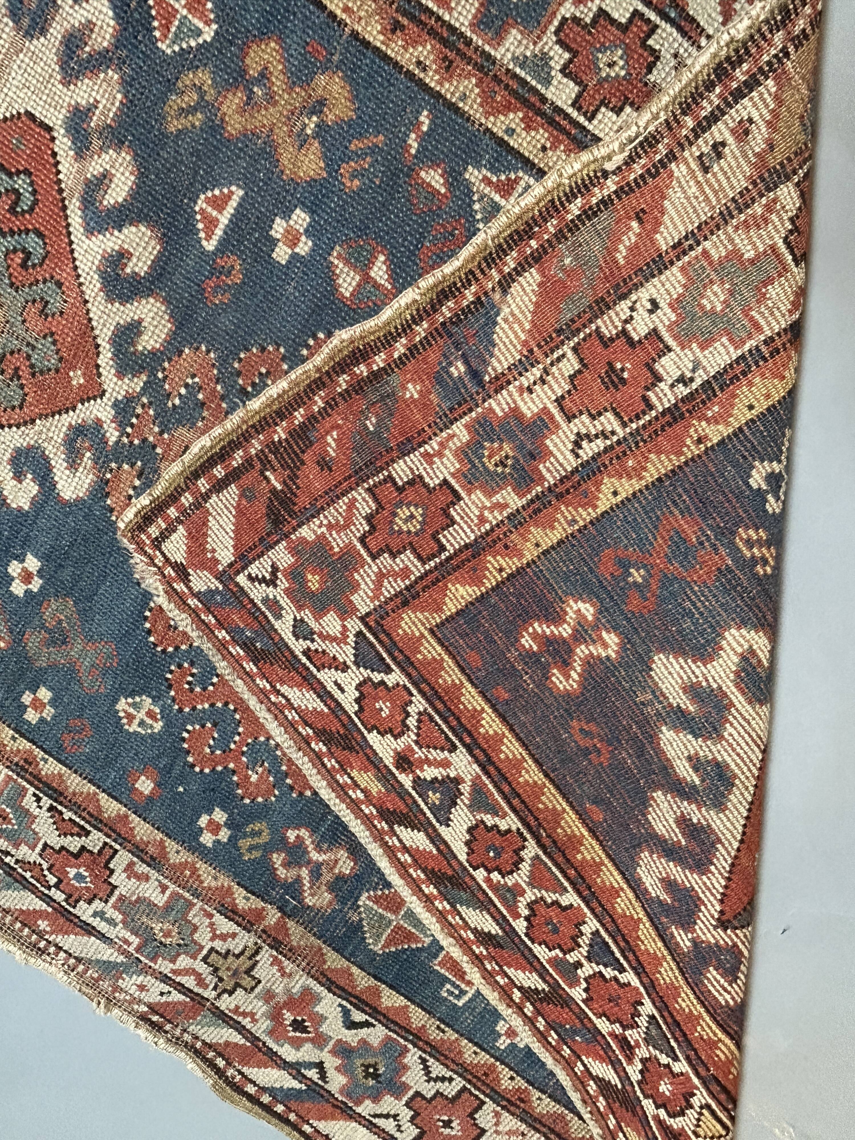 Antique kazak rug blue ground
