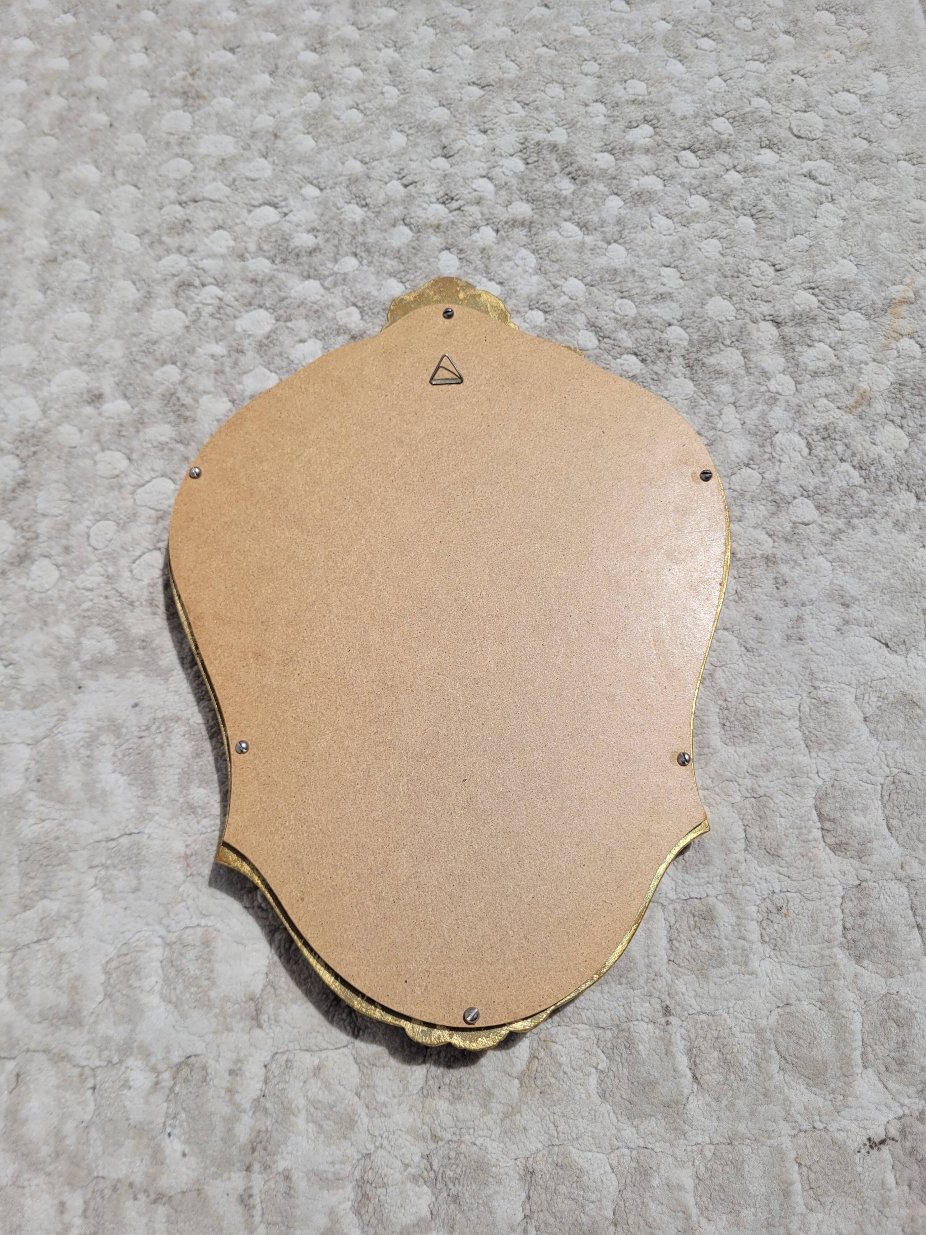 Small golden mirror 22x32cm shell pediment