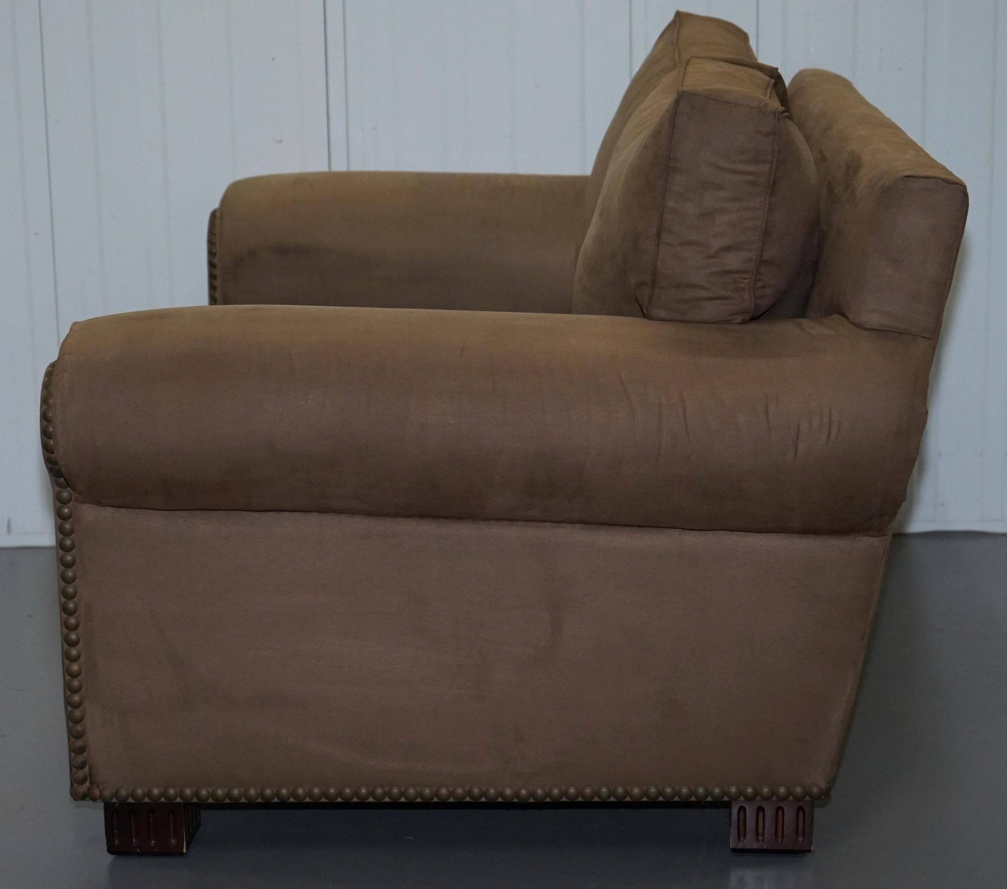 Ralph Lauren Jamaica velvet sofa pair with feather cushions.
