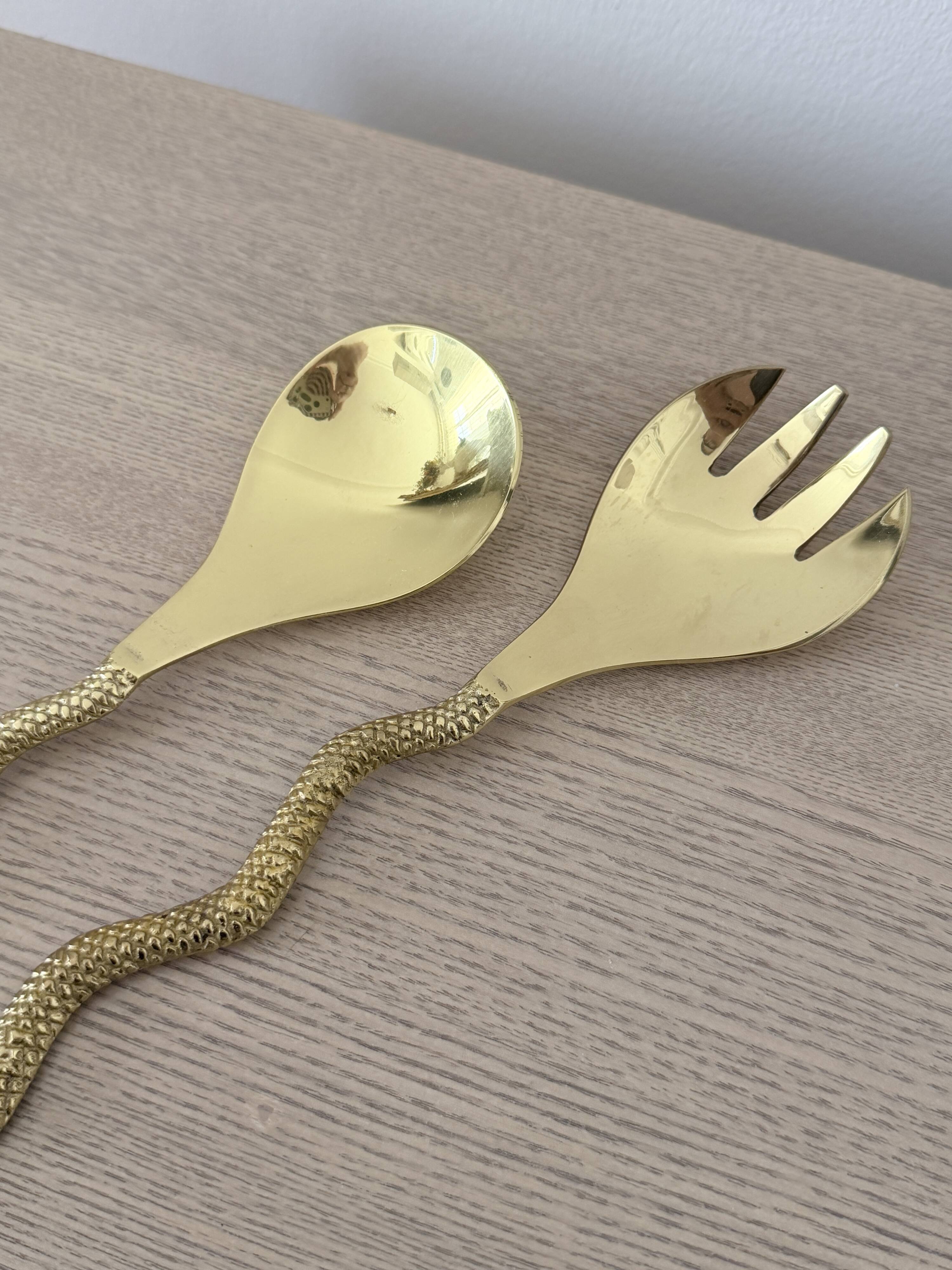 Gold metal snake salad serving set