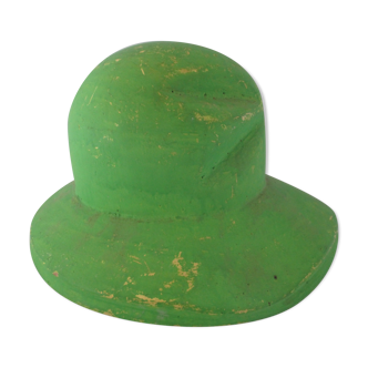 Pressed plaster hat mold with green textile fiber surface