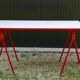 Desk with red trestles, white plaid tray, 80s