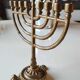 Ancient Menorah of Jerusalem/Jewish Candlestick with 7 tripod branches. Star David. In gilded bronze