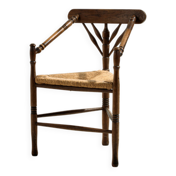 Oak armchair with three legs