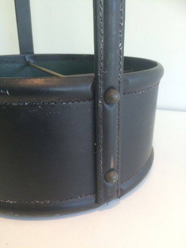 Leather wall magazine rack. In the style of Jacques Adnet.