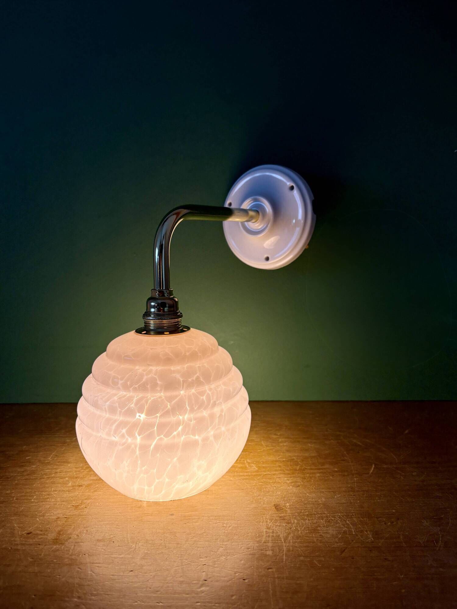 Vintage pink Clichy glass globe wall light.