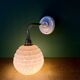 Vintage pink Clichy glass globe wall light.