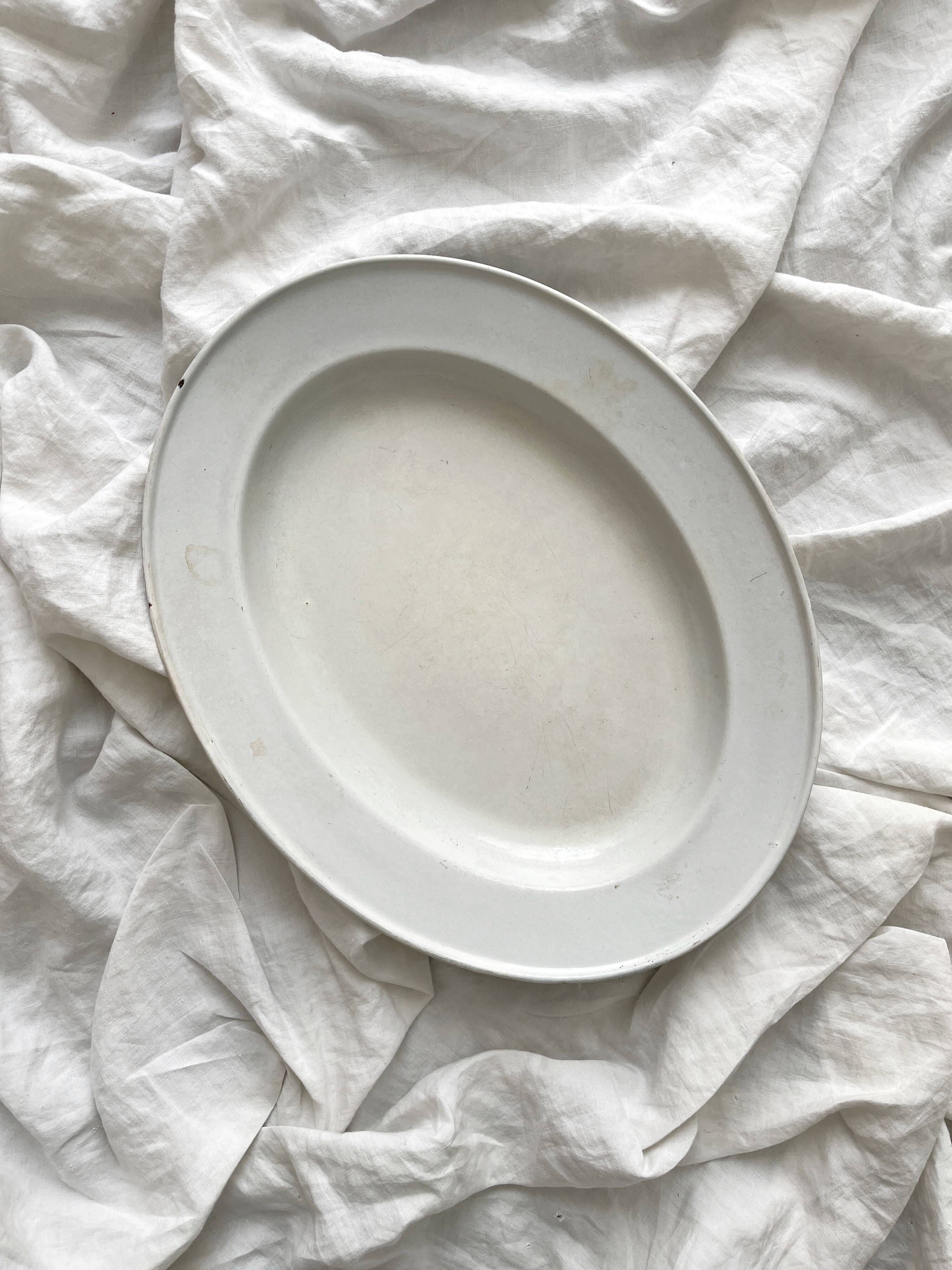 Vintage marbled white and blue enameled sheet metal oval dish