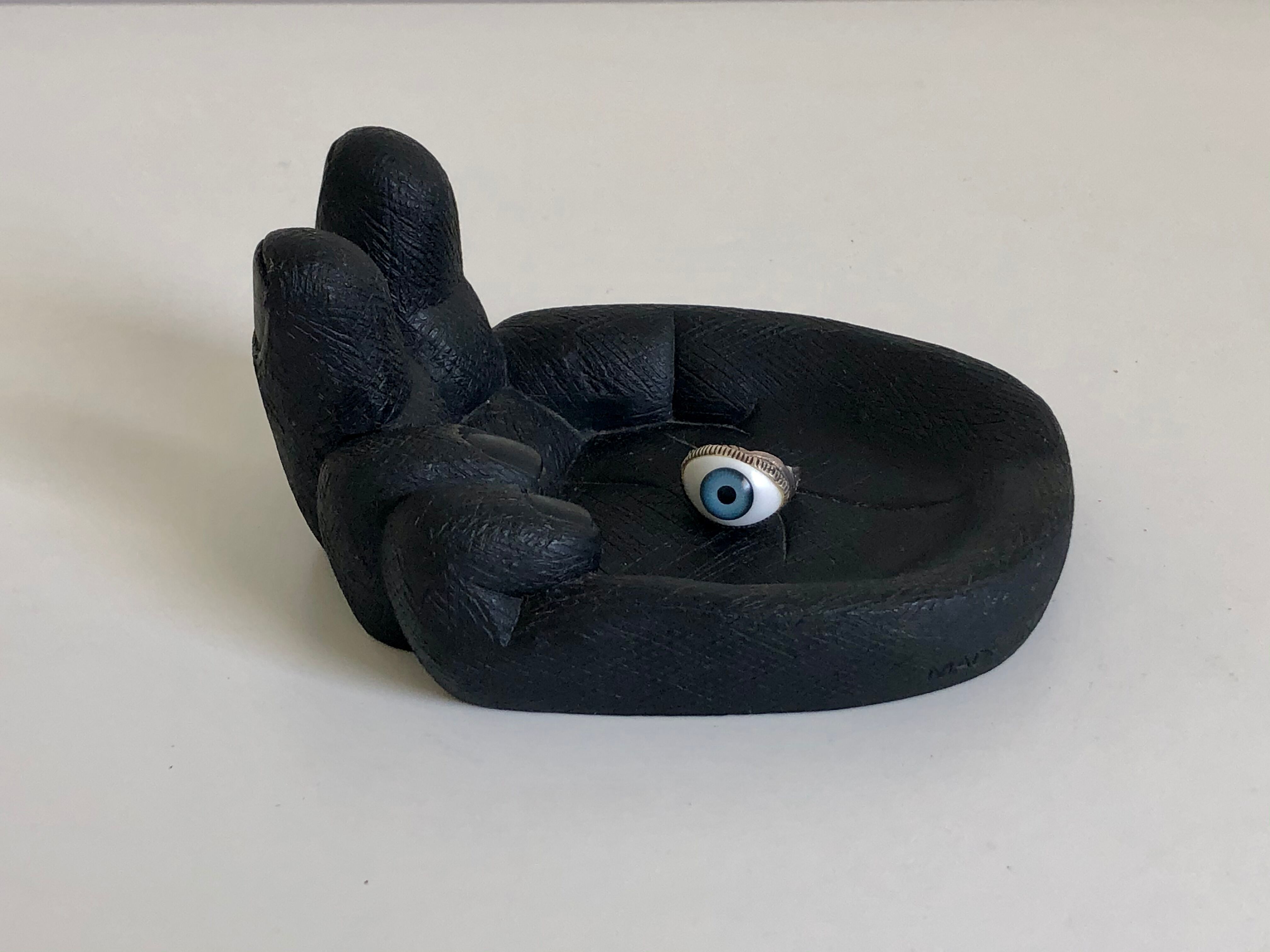 Empty pocket in Hawaiian lava in the shape of a hand signed Coco Joe, 1960