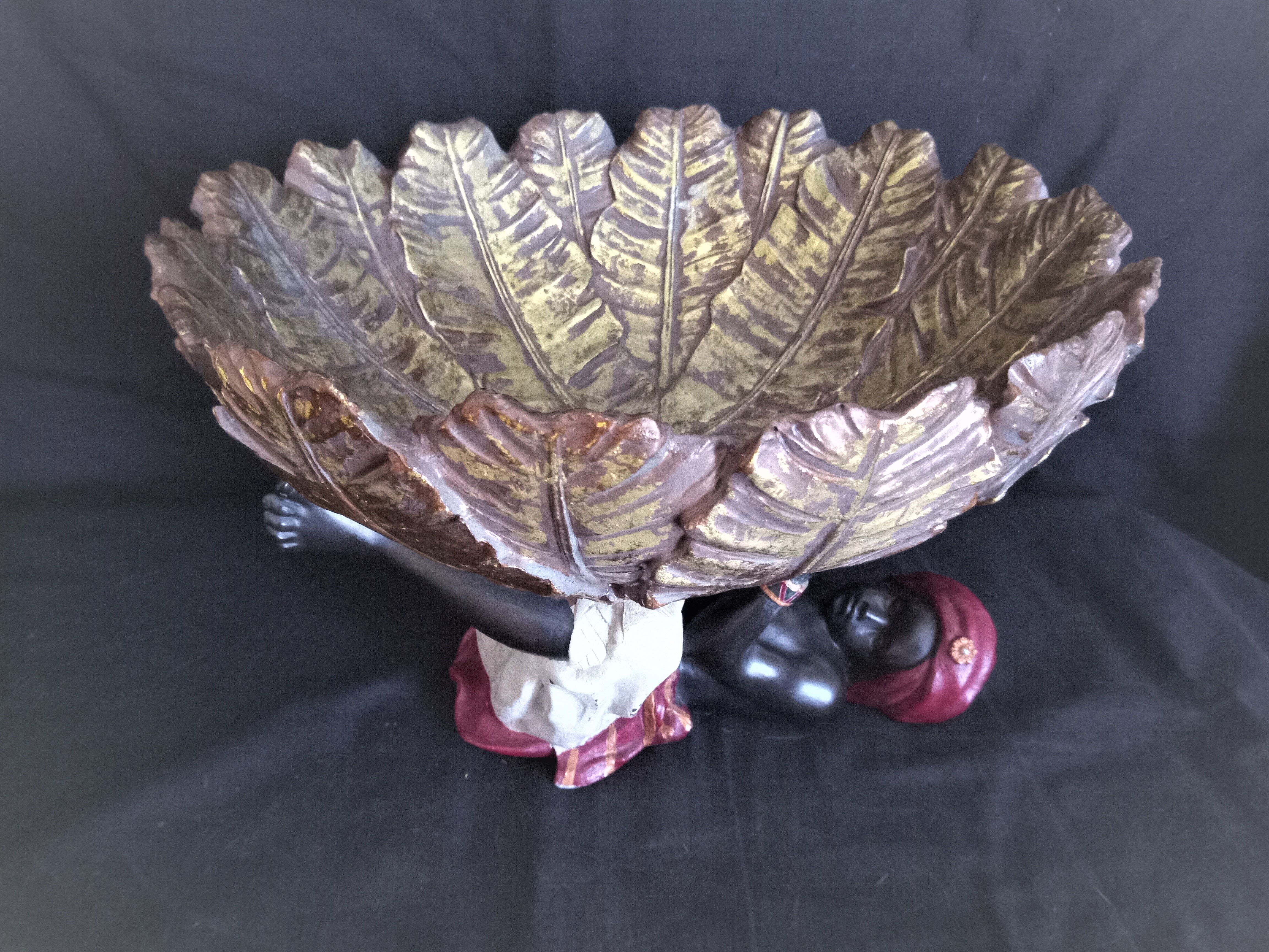 Centerpiece (empty pocket) in resin with African character