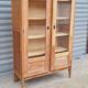 Armoire pied compas en chêne blond