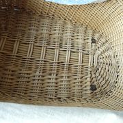 Old wooden cradle and wicker on wheels