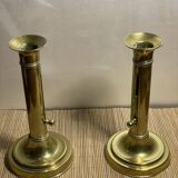 Duo de bougeoirs poussoir en laiton