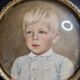 Miniature portrait of a young boy signed, wooden frame with convex glass, 12x12 cm.