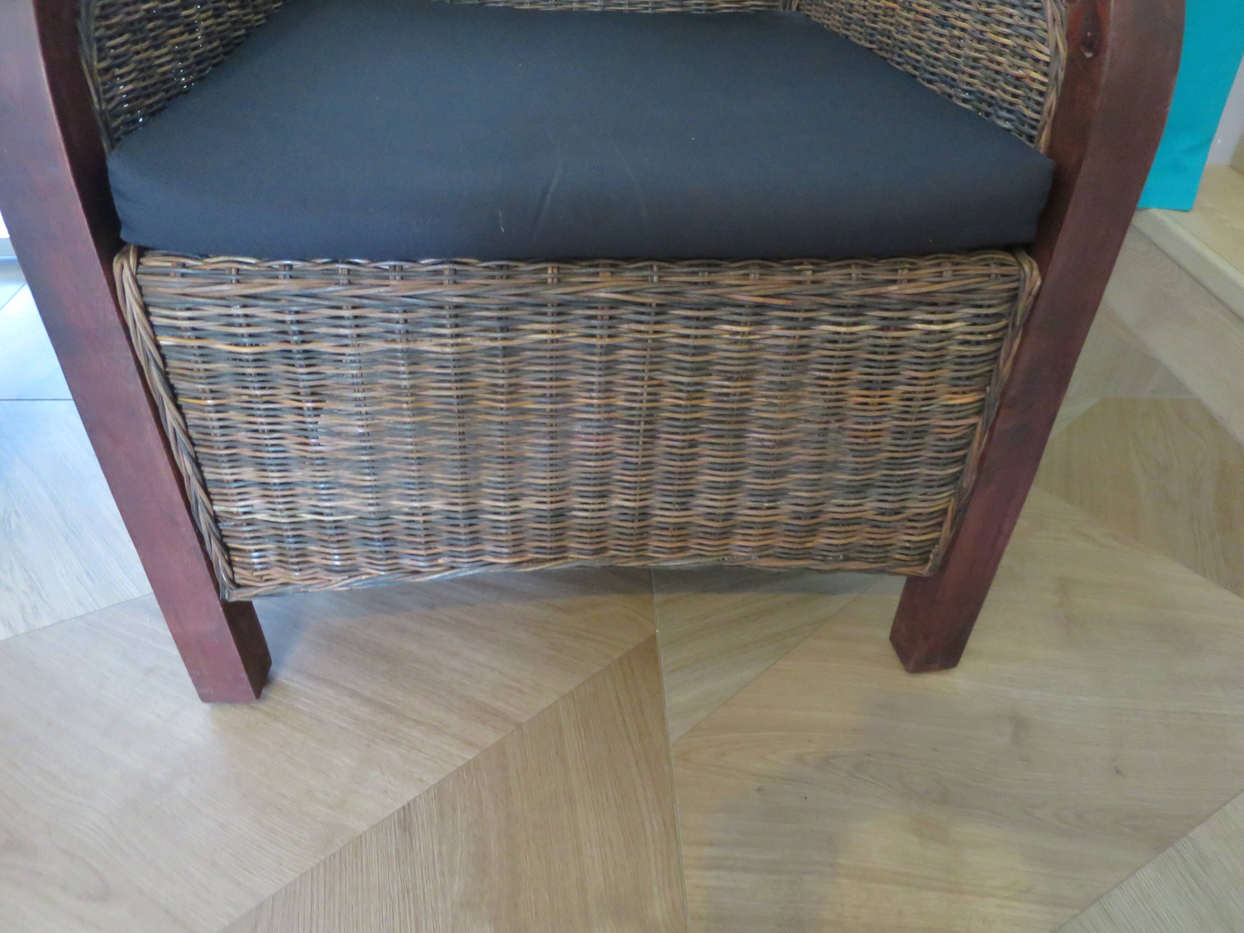 2 colonial-style armchairs in woven rattan and exotic wood