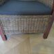 2 colonial-style armchairs in woven rattan and exotic wood