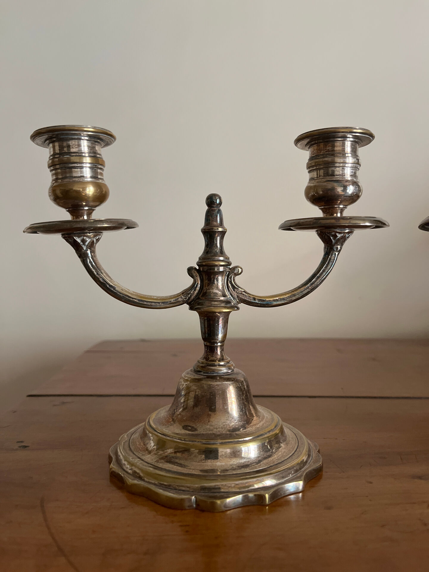 Pair of two-armed candelabra in silver-plated metal