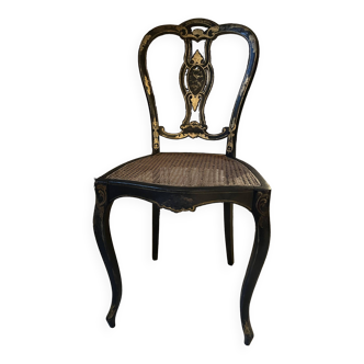 Blackened wooden chair